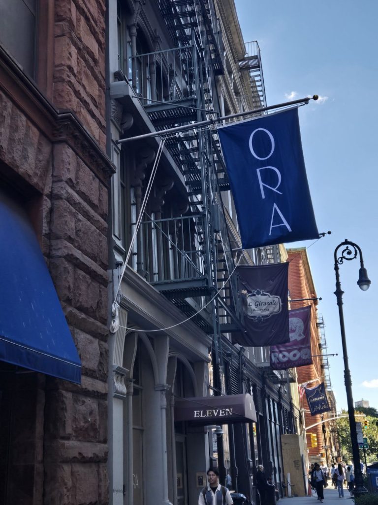 Custom banner featuring a business logo, displayed at a corporate event in NYC.